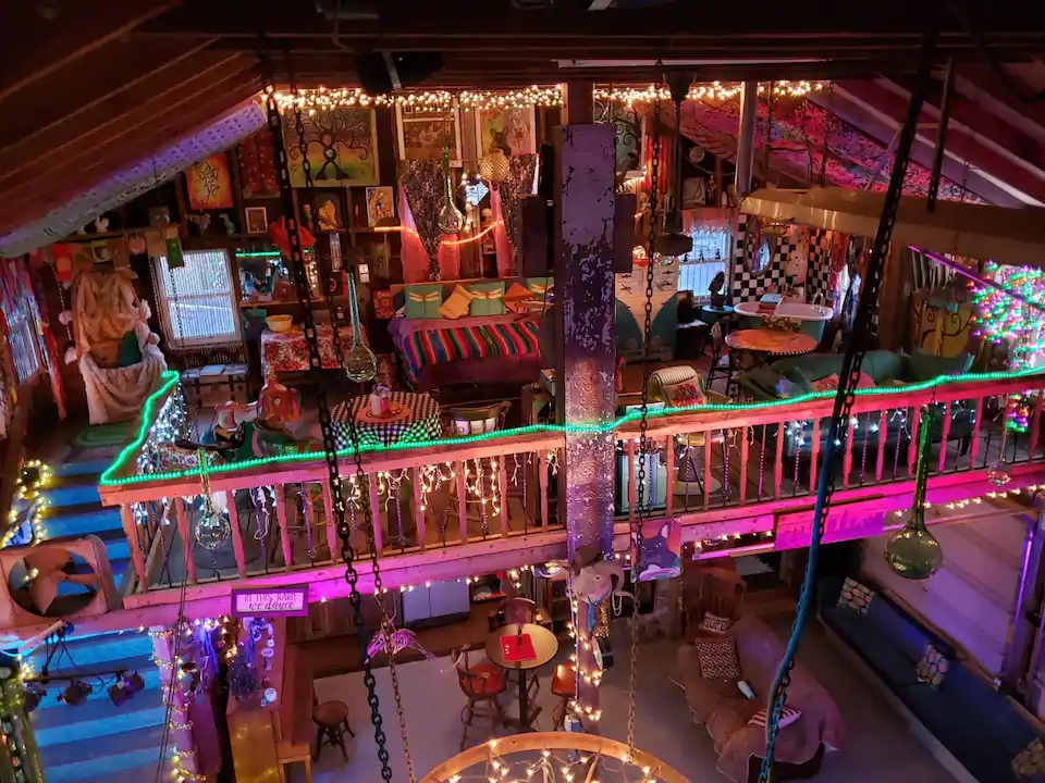Bright colorful photo of eclectic barn with neon land twinking lights. This is one of the best Airbnbs in Ohio.