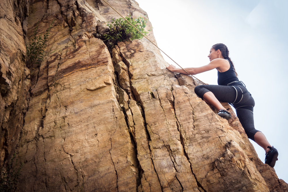 a girl rock climbing