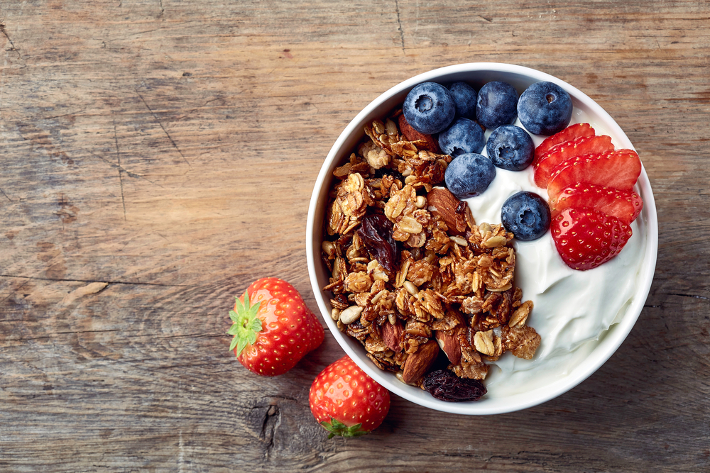 bowl of granola with yogurt and fresh berries best breakfast in paris