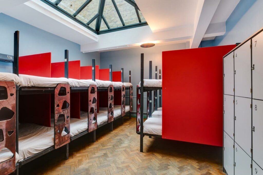 red white bunk beds with lockers in a room