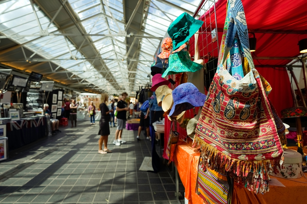 stalls of accessories and shopping products in a covered area things to do in greenwich