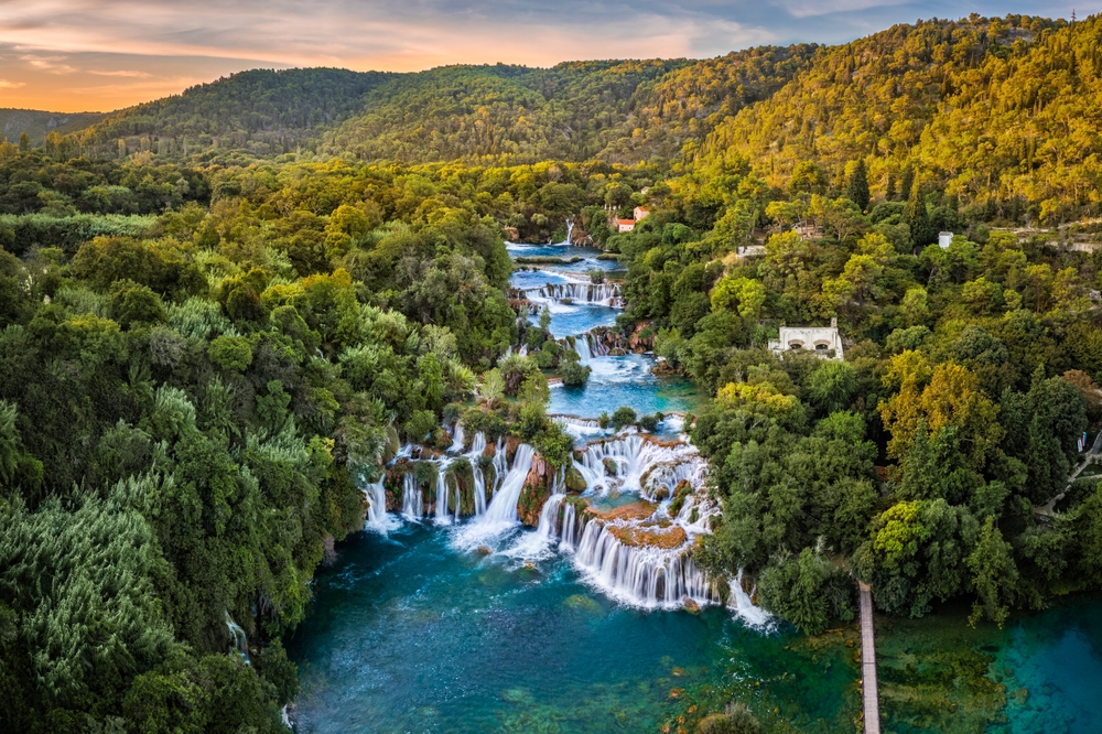 aerial view of cascading waterfalls in a national  park day trips from split