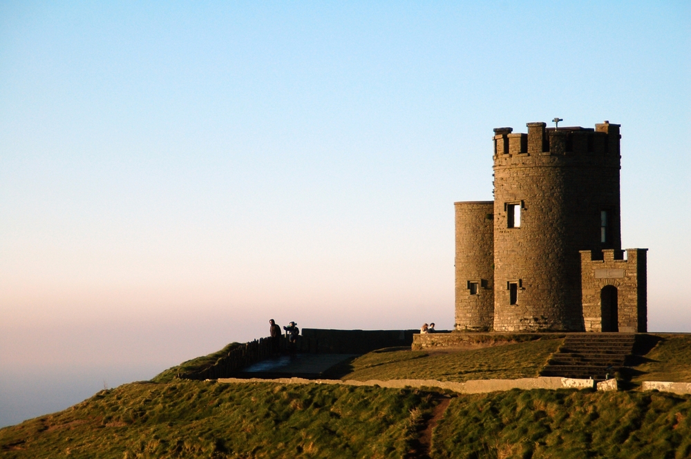 tower during sunset cliffs of moher ireland
