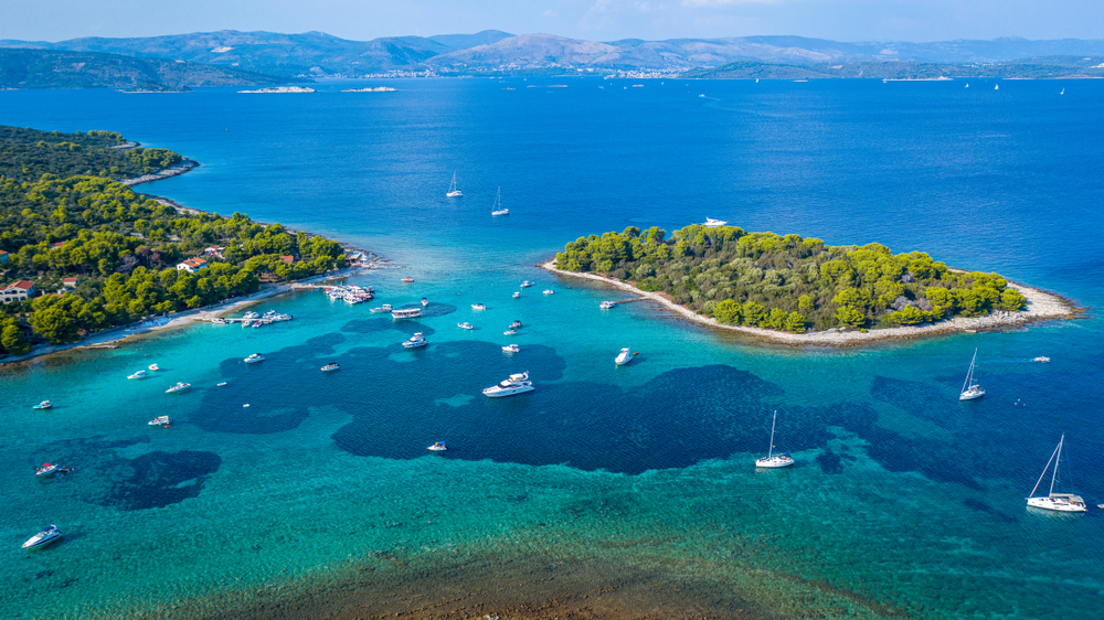 Aerial image of the blue lagoon surrounded by boats and islands
