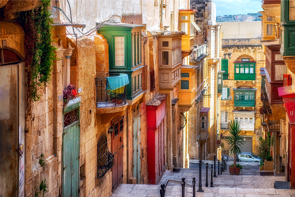 narrow street with colorful houses places to visit in malta