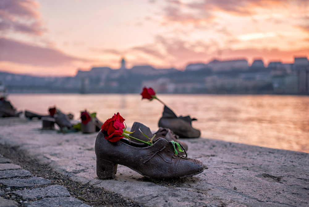shoes on the bank of a river one day in budapest