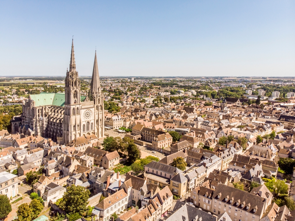 aerial view of a city with a large cathedral best day trips from paris