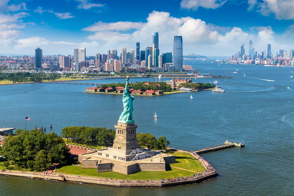aerial view of statue of liberty and the surrounding city and islands