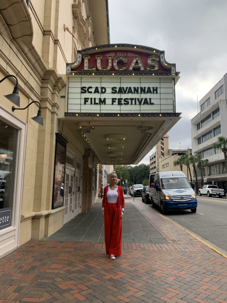 woman standing in front of the theatre