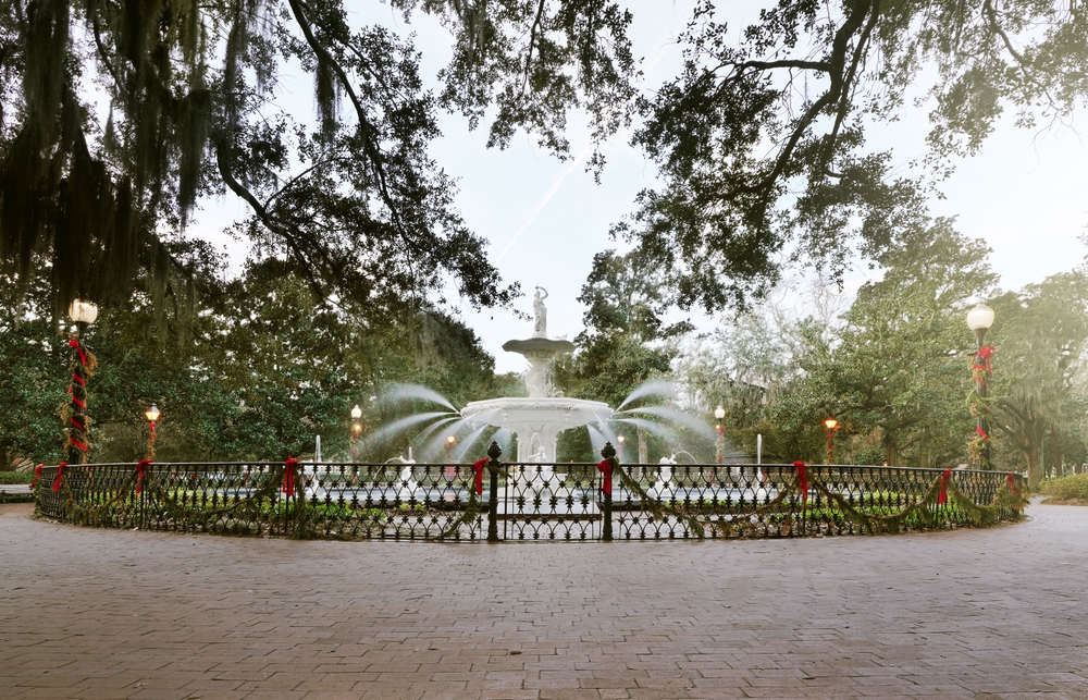 fountain at park with christmas decor