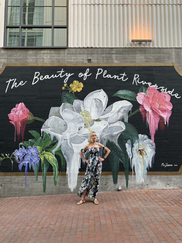 woman standing in front of the plant riverside art best things to do in savannah