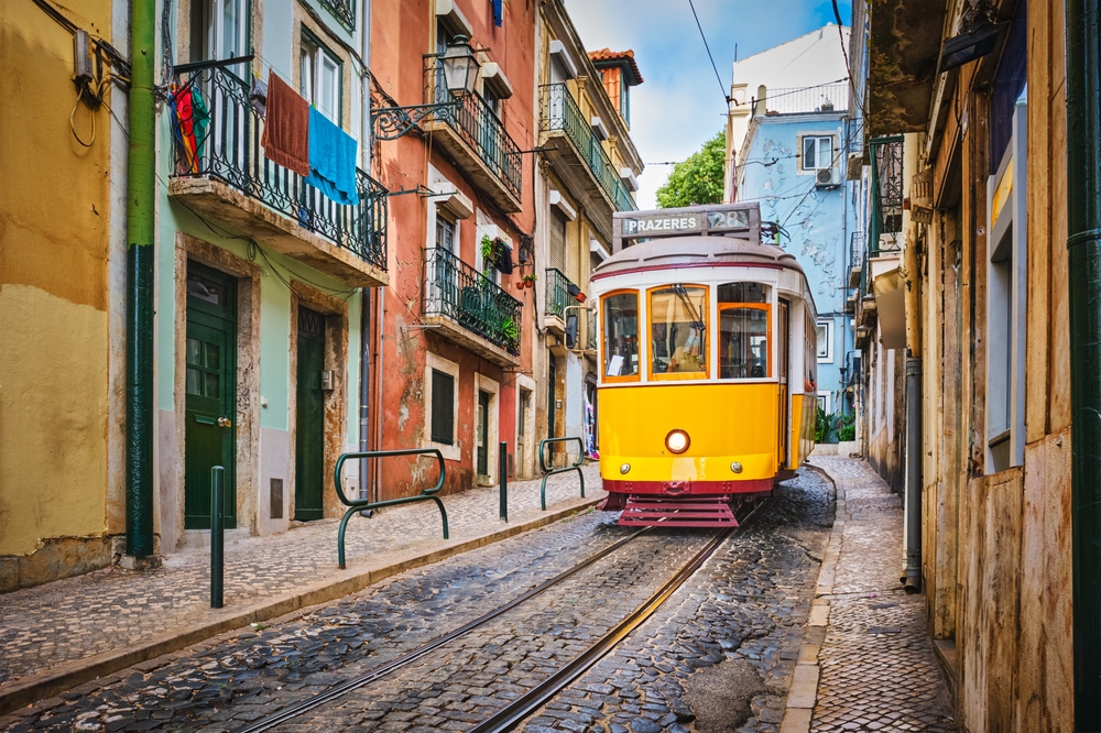 yellow tram in a street romantic cities in europe