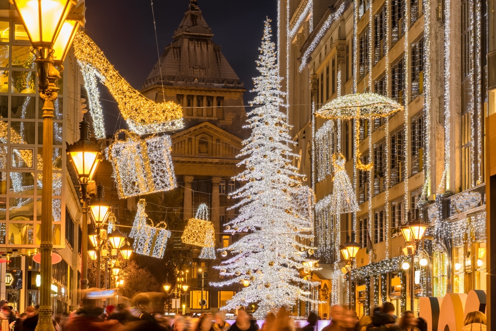 white tree in a christmas market christmas vacation ideas