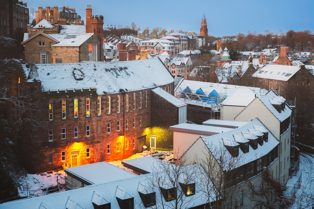 snow covered roofs in a city