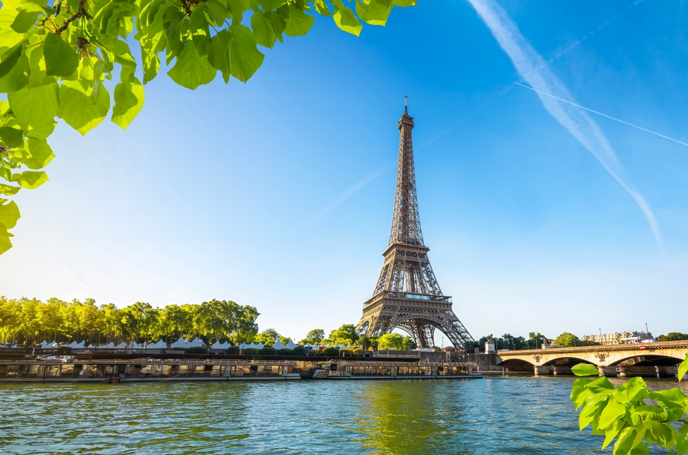 eiffel tower beside river summer in europe