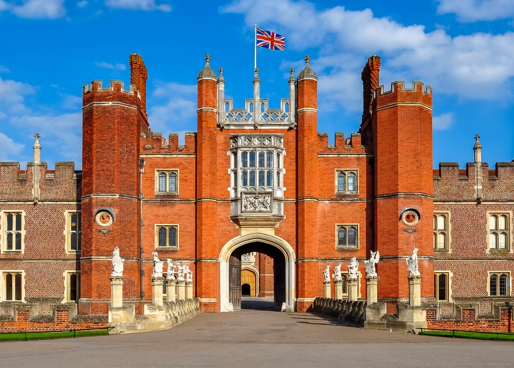 red brick colored building with a flag on top of it