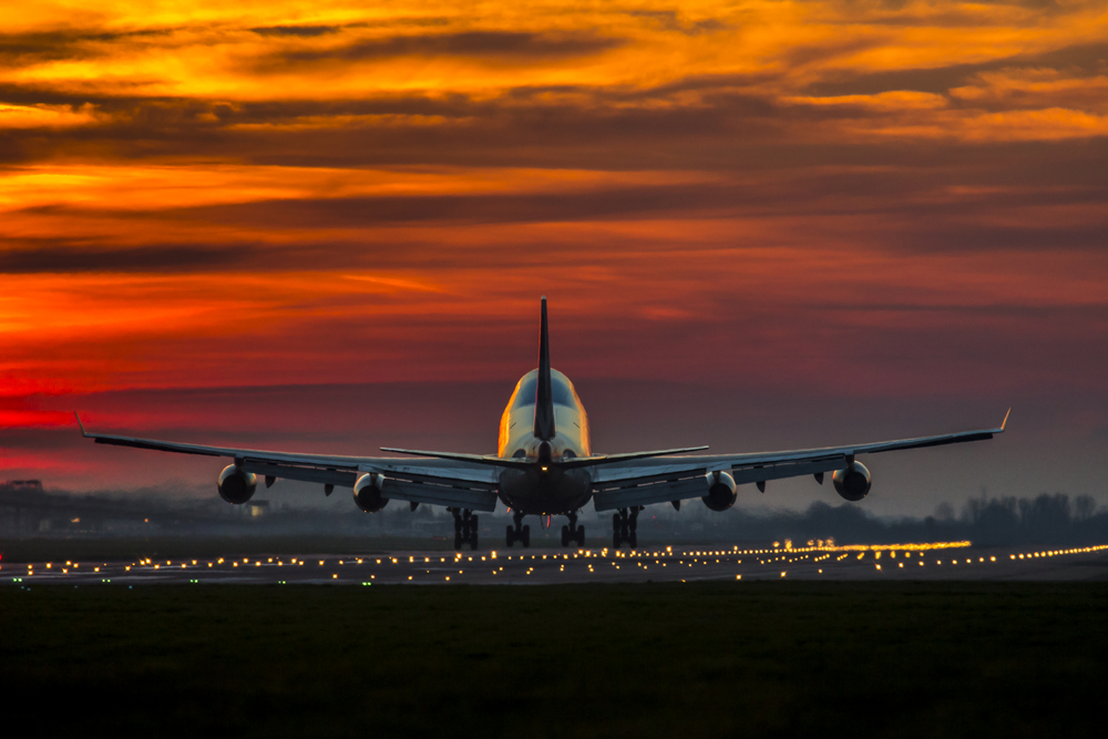 aircraft landing during sunset