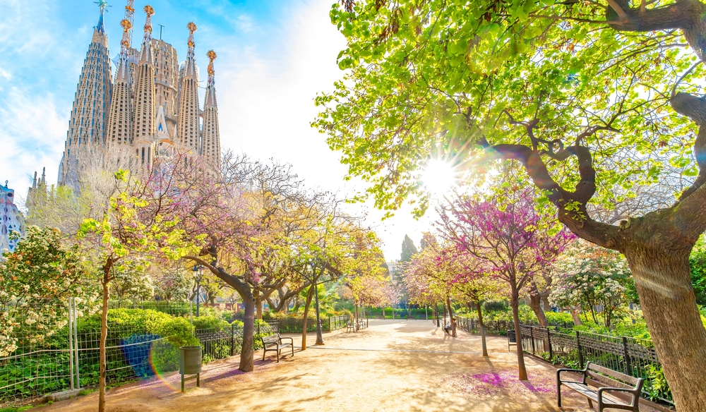 blooming spring park in front of a huge building with intricate architecture Best Spring Break Destinations for Families