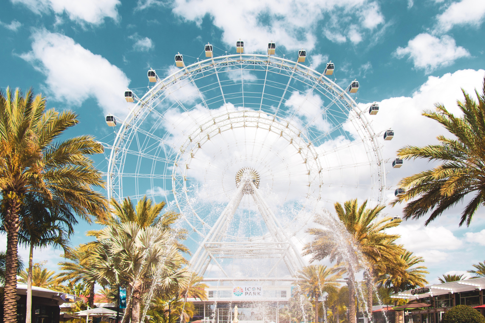 ferris wheel surrounded by palm trees Best Spring Break Destinations for Families