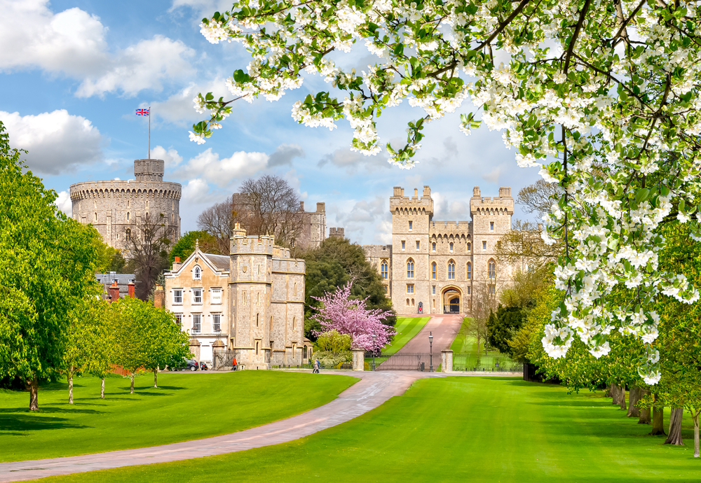 path leading to a castle surrounded by trees and spring flowers things to do near heathrow