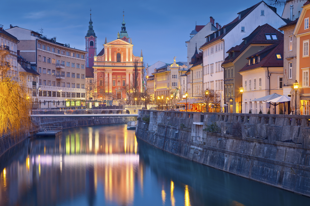 evening view of a town with reflection in the river spring in europe