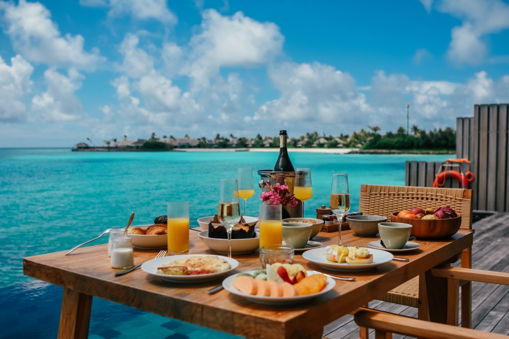 food served on a table with ocean views traveling to the maldives