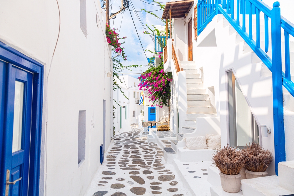 white and blue buildings traveling to greece