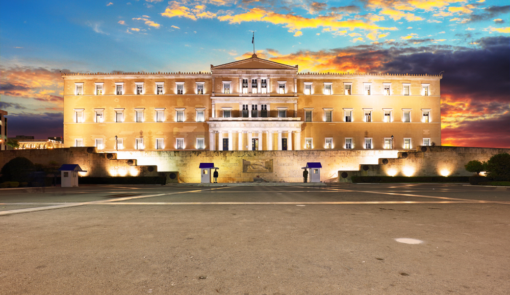 yellow and white building lit during the sunset things to do in athens