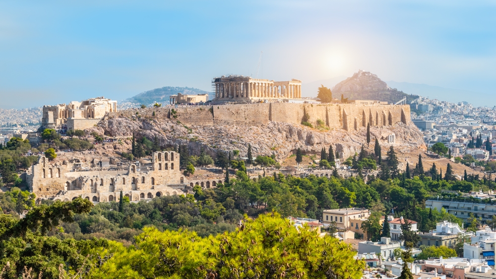 panoramic view of city with ruins on the cliffs traveling to athens