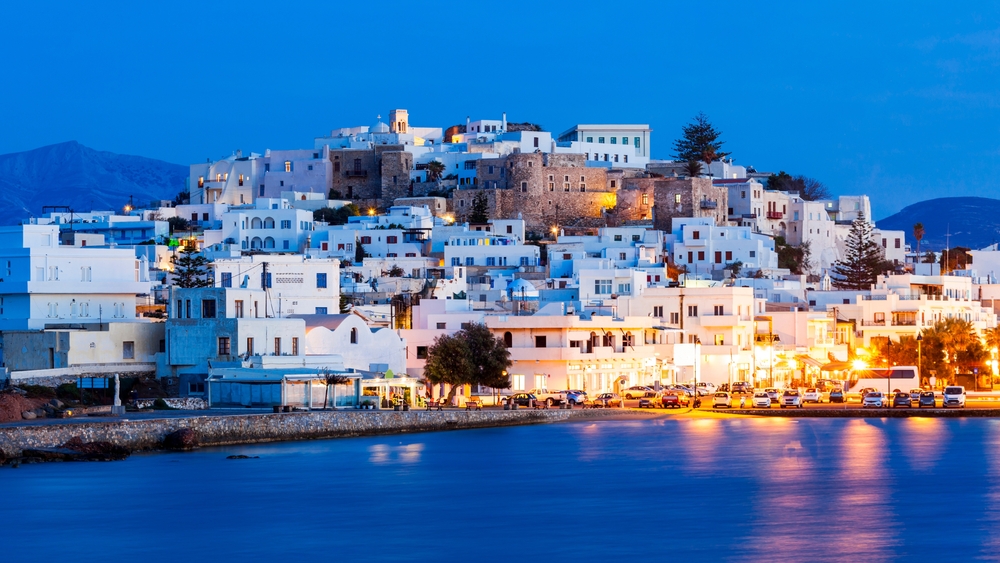 island with white buildings during the night time