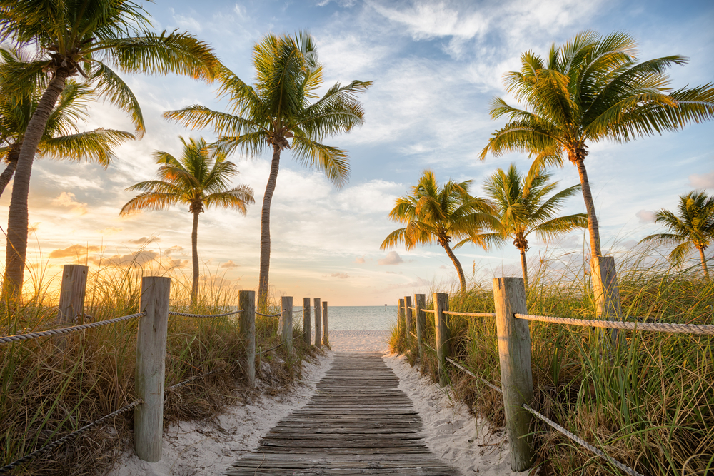 footbridge to a beach warm weather getaways