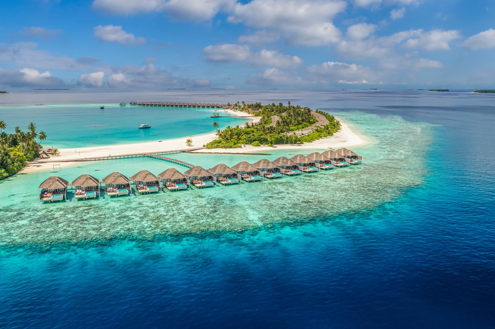 aerial view of island with floating cottages