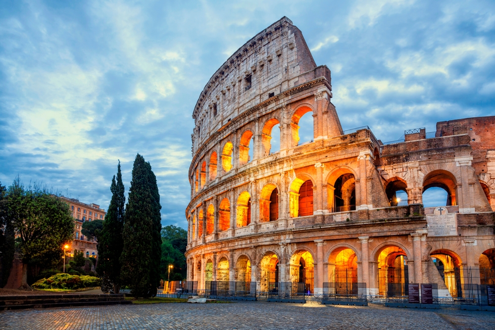 colosseum in the morning lit up traveling to italy
