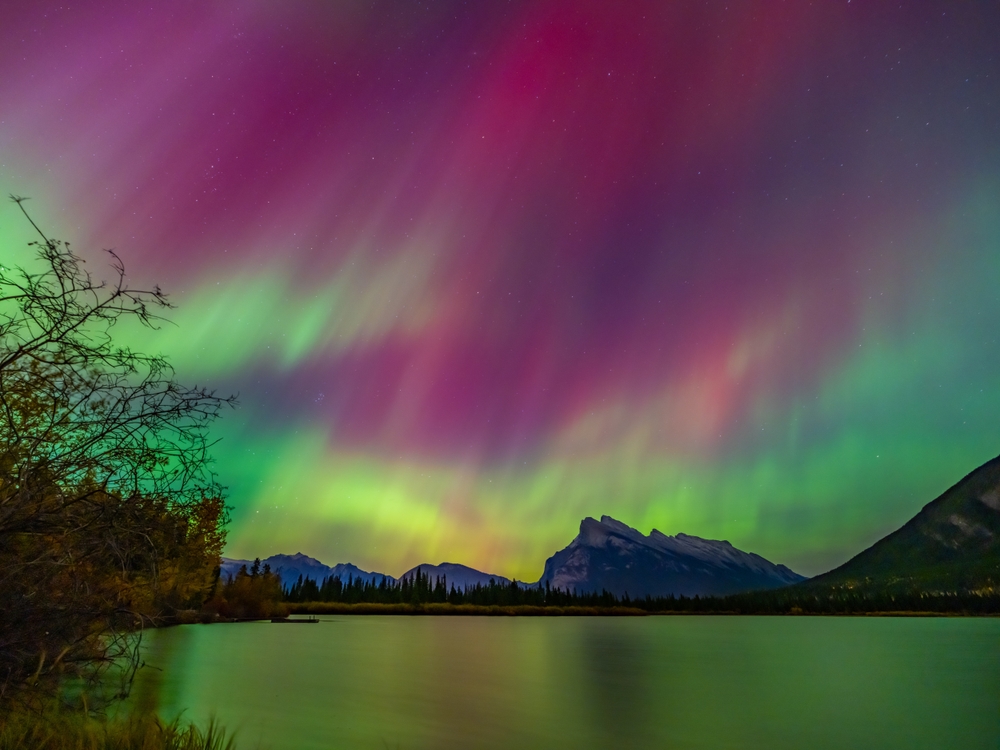 northern lights shining over the lake things to do in banff