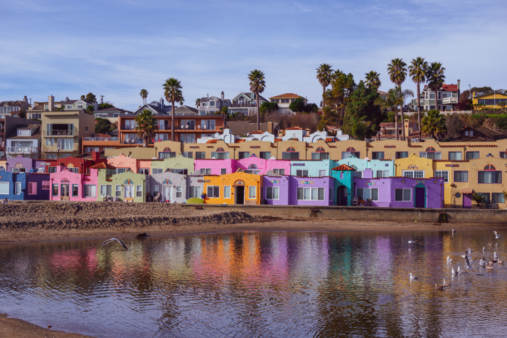 colorful houses on a bank by the water oregon coast getaways