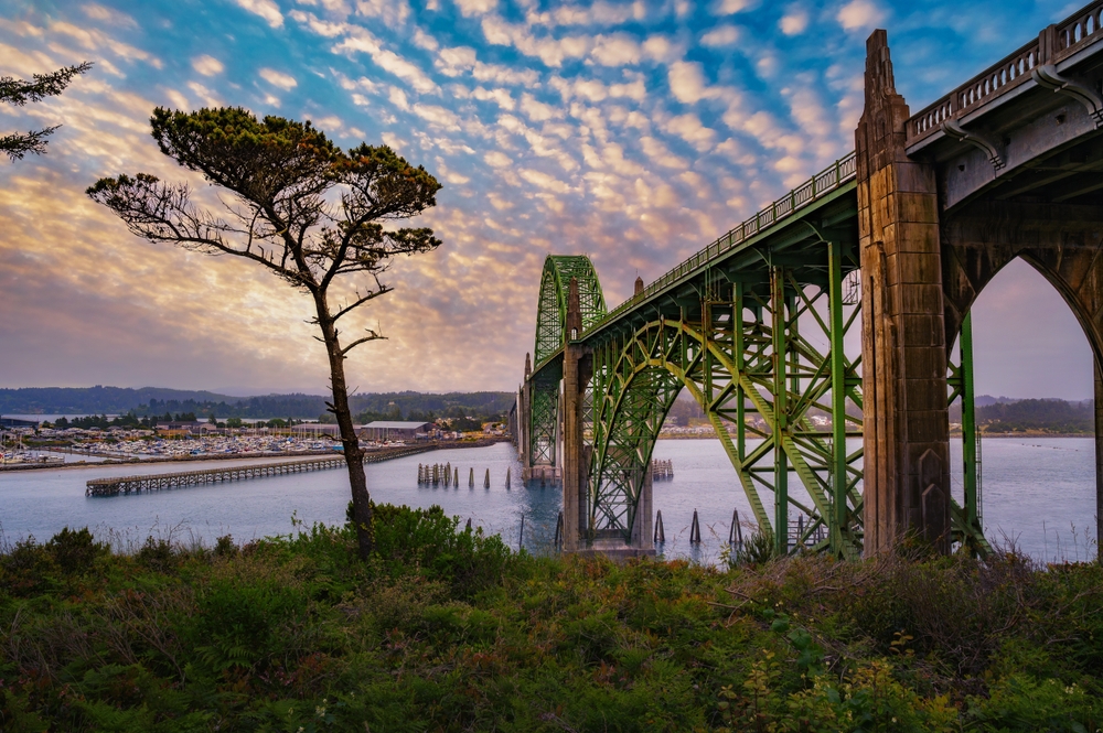sunset over a bridge oregon coast getaways