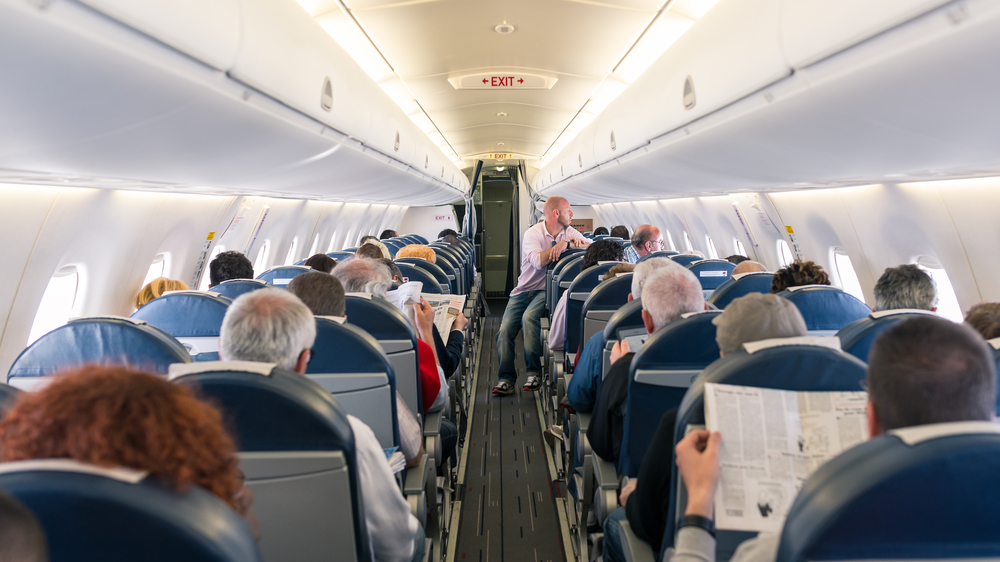 how not to get sick on a plane do not sit in aisle