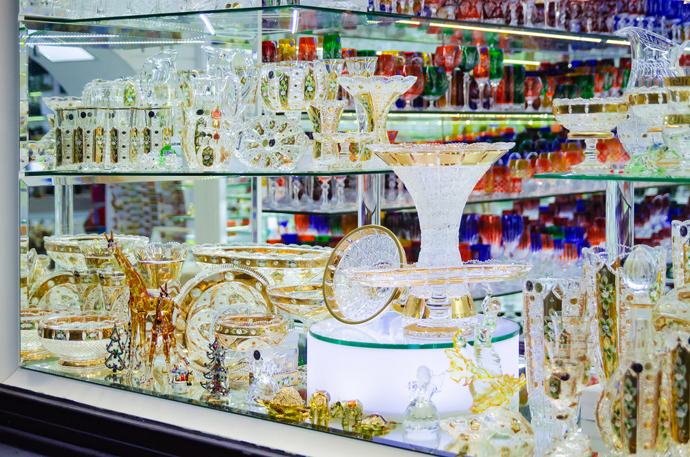 Shop window with shelves of intricate Bohemian crystal.