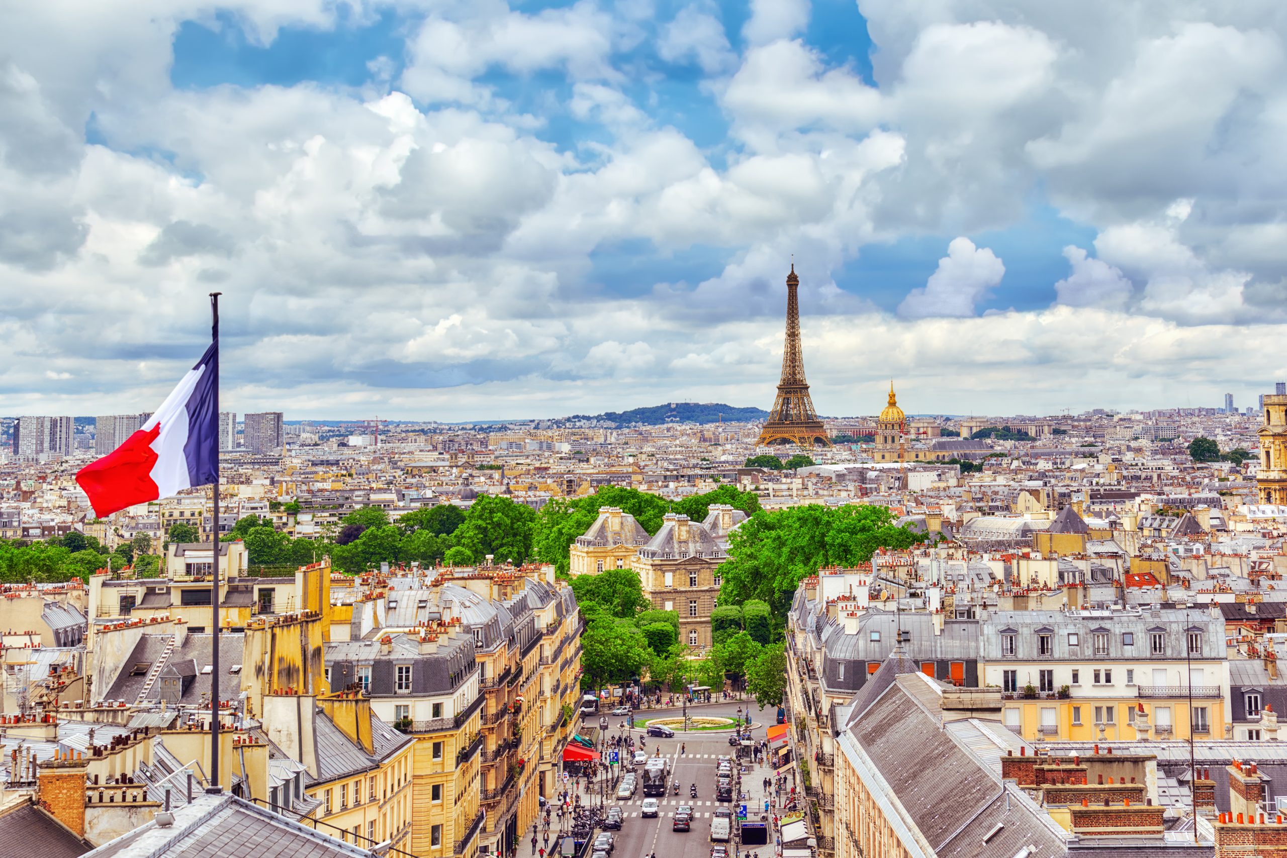 Best views in Paris from the Pantheon featuring the Eiffel Tower and flying French flag.