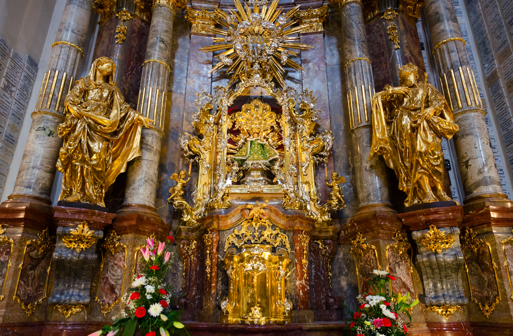 Ornate, golden, and Baroque Infant Jesus of Prague Church.