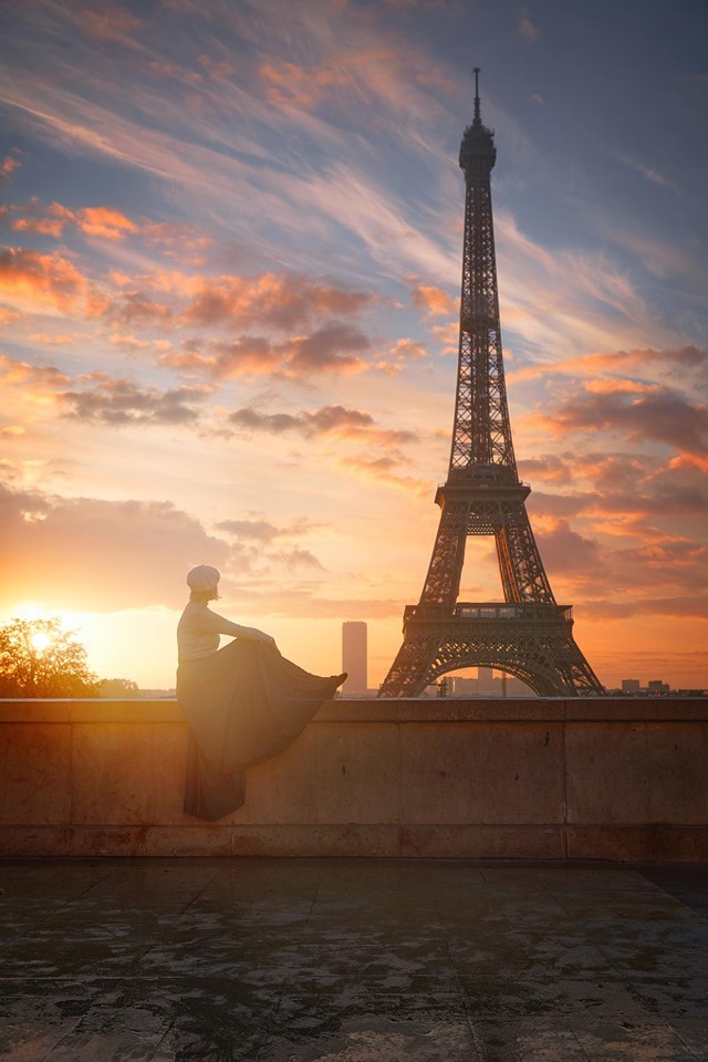 sitting at the Trocadero watching the sunrise over the Eiffel Tower