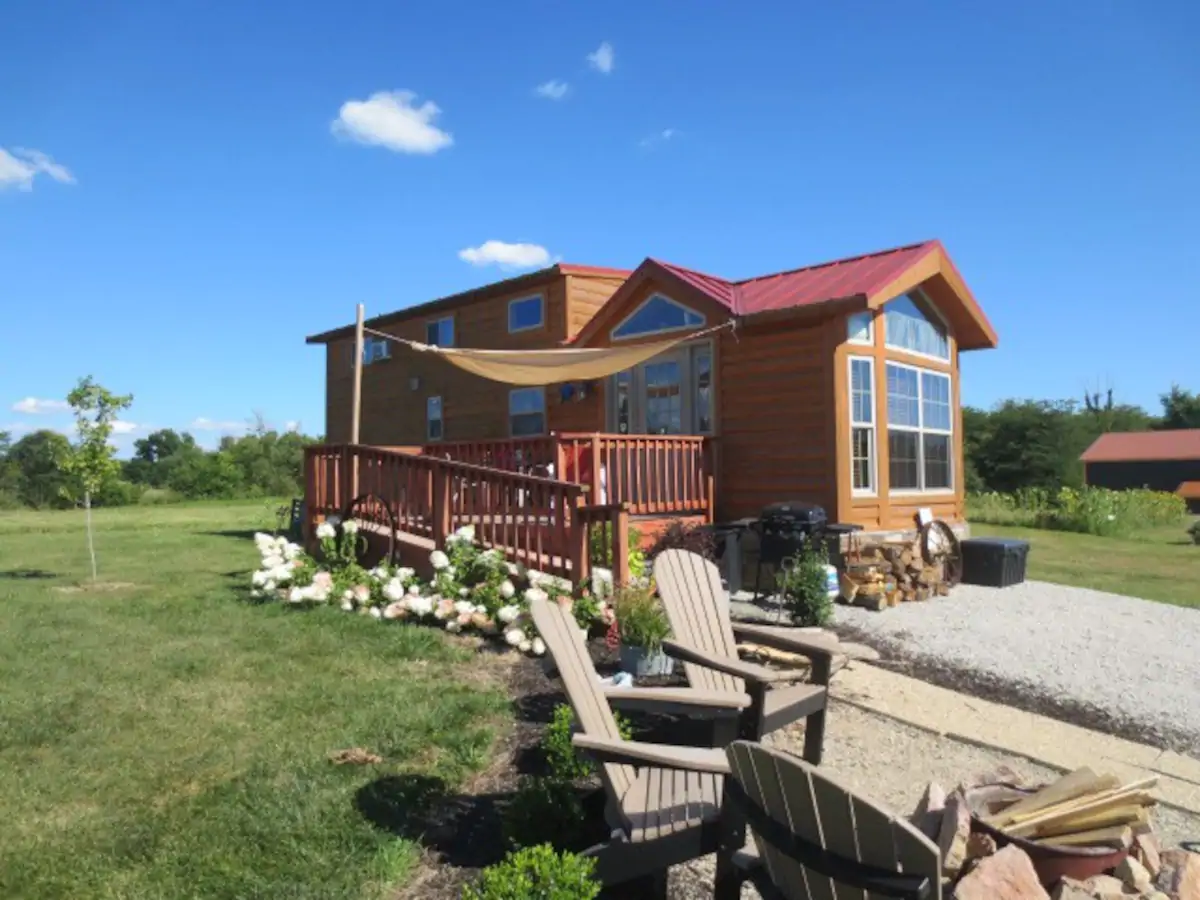 Tiny house with lawn chairs in Indiana