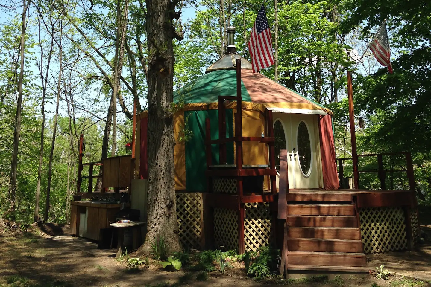 Yurt in Indiana in the woods with American flags