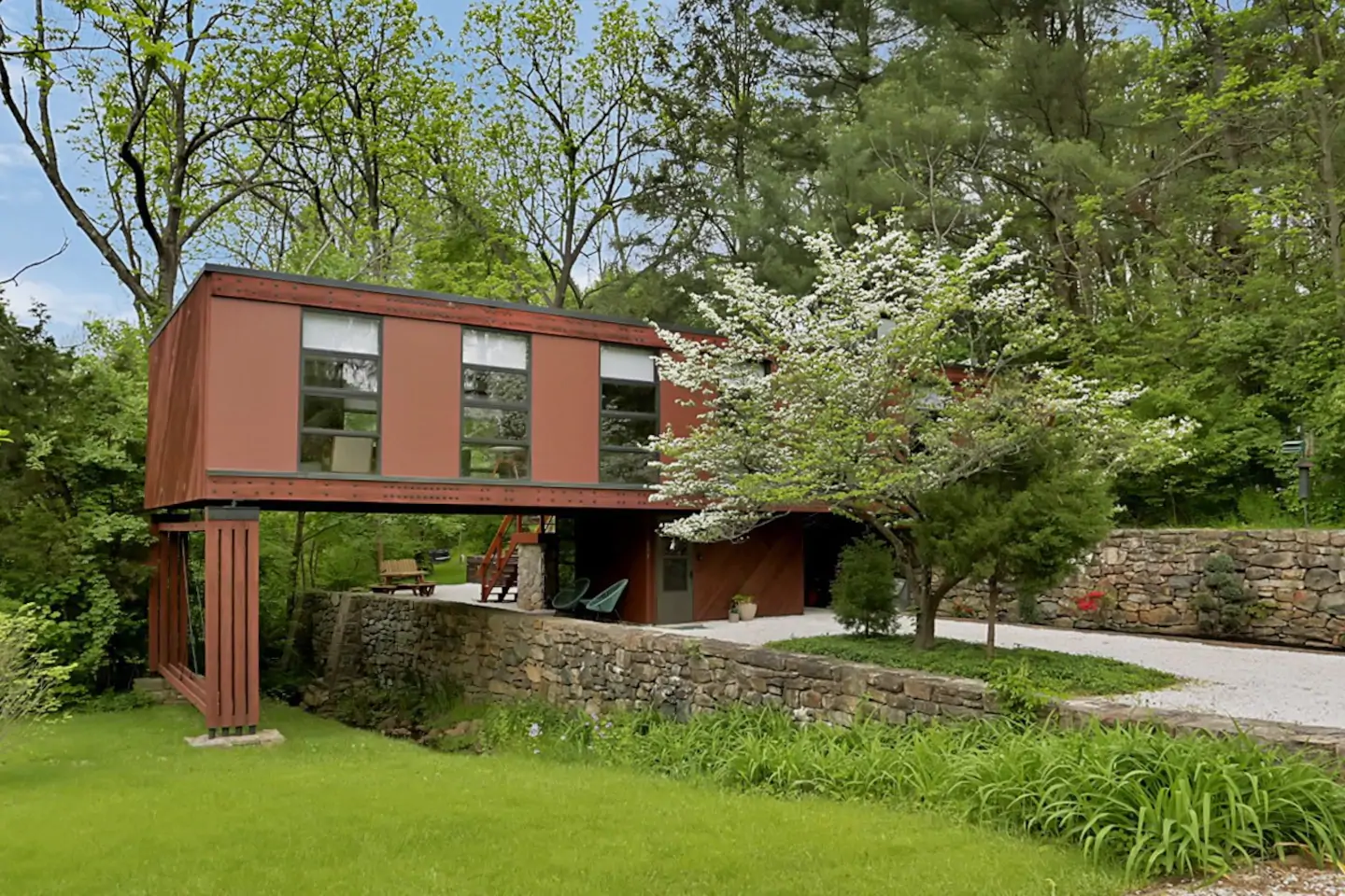 Mid Century Modern home with lots of trees around it.