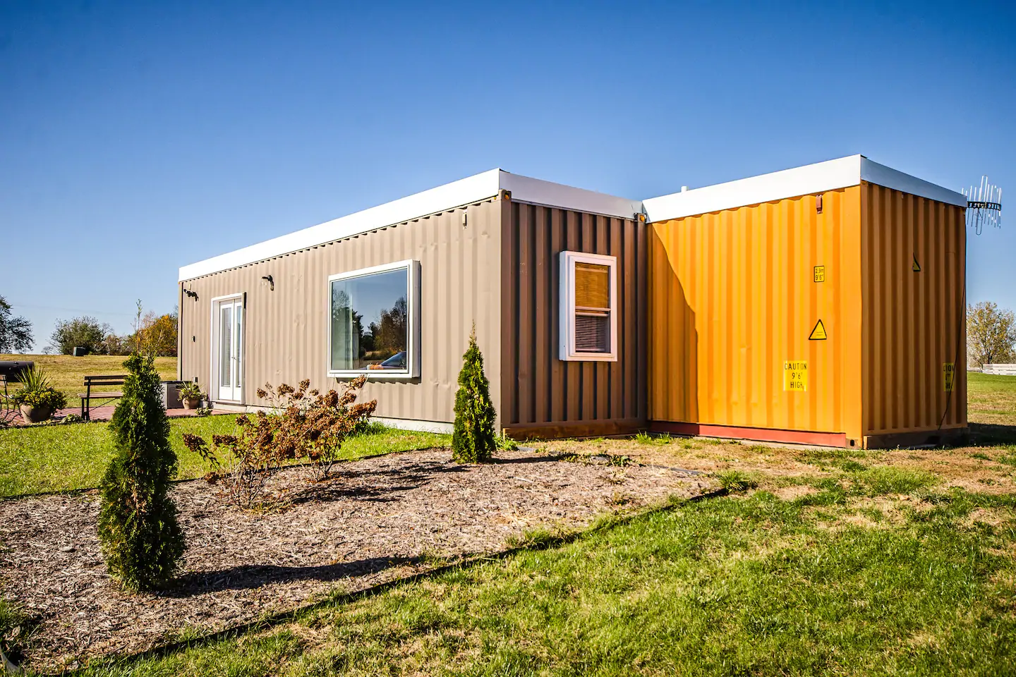 Two shipping containers together form one large living space
