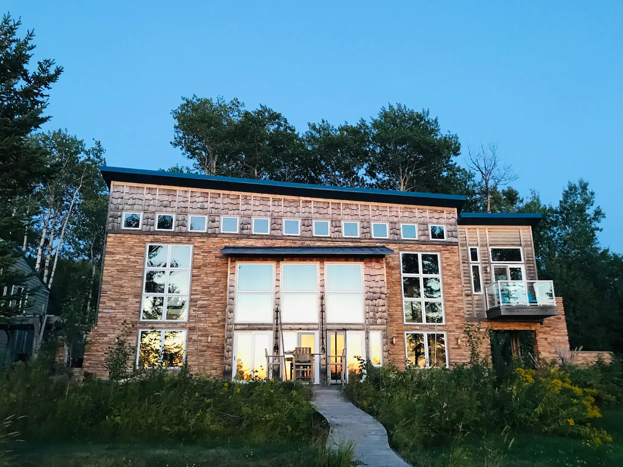 Beautiful Bark Point Home showing lots of windows to bring the outside indoors.