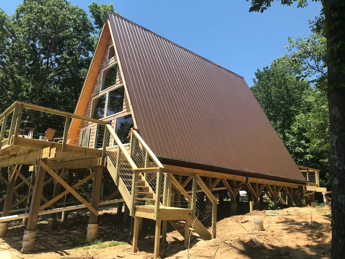 Photo of beautiful A-frame chalet with brown tin roof/ One of the best chalets in Illinois.