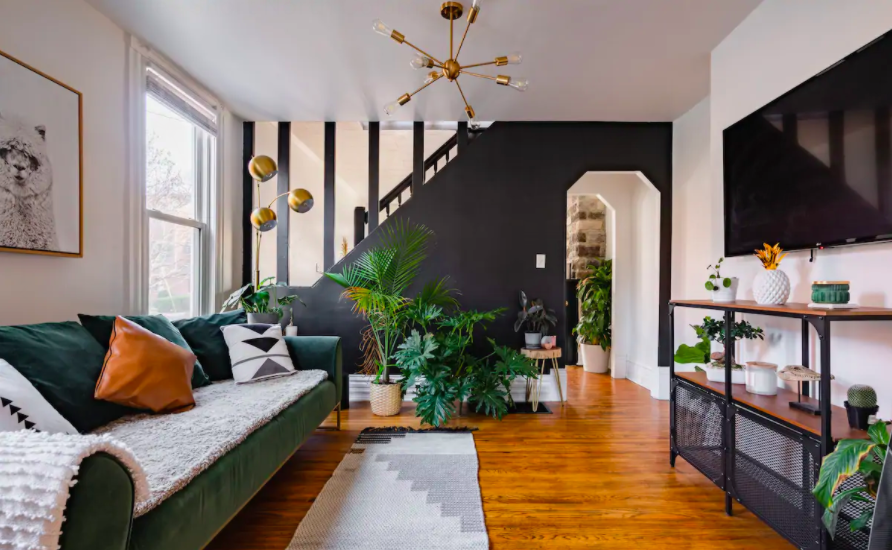 modern living room area filled with rare plants best Airbnbs in Columbus