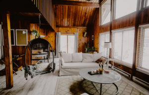 living room in cabin with bright white couch
