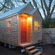 Photo of tiny cabin with light streaming outside.
